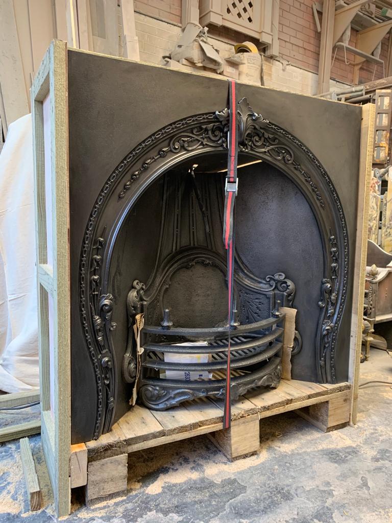 Antique fireplace insert being packaged for shipping to America by Griffin Antique Fireplaces